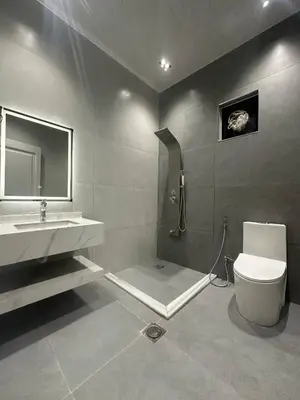 a bathroom with a sink and a toilet and a mirror at Luxury Haven villa in Jerash