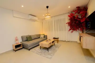 a living room with a couch and a table at Maria Suites 2 in Aqaba