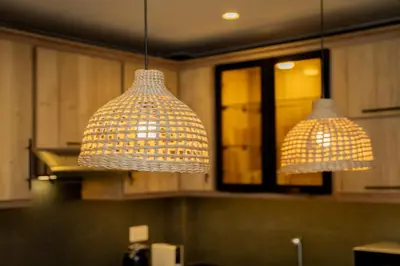 two chandeliers hanging from the ceiling in a kitchen at Maria Suites 2 in Aqaba