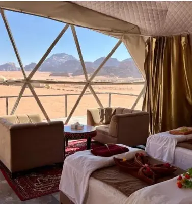 a room with two beds and a view of the desert at Wadi Rum, the best stars in Wadi Rum