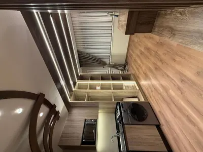 an overhead view of a kitchen in a tiny house at amazing rooftop studio at abdoun 702 in Amman