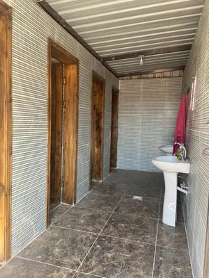 a bathroom with a toilet and a sink at Desert Time in Wadi Rum
