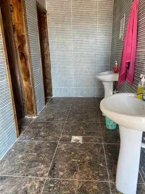 a bathroom with a sink and a toilet at Desert Time in Wadi Rum