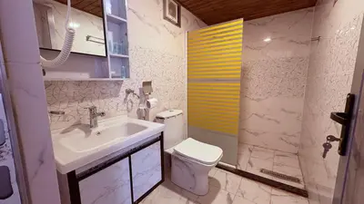 a bathroom with a sink and a toilet at HAGIA SOPHIA lUXURY CAMP in Disah