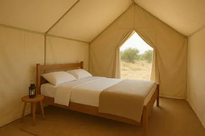 a bedroom with a bed in a tent at 1moon valley camp in Al Jafr