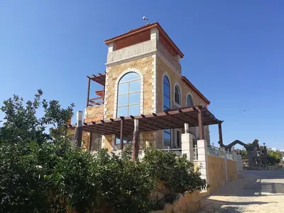 a building with a tower on top of it at Green Hills in Ajloun