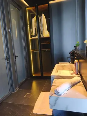 a room with four beds and a closet at Deep House Villas in Al Rama