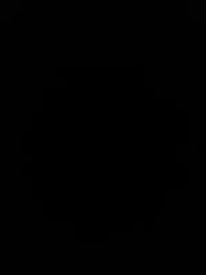 a dark room with a clock on the wall at Camb wadi Rum in Disah