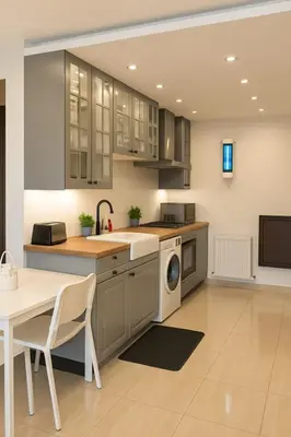 a kitchen with a sink and a dishwasher at Elite Apartment Compound 1 in Amman