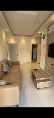 a living room with a couch and a coffee table at 2 bedroom studio - Fully furnished in Irbid