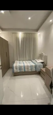 a small bedroom with a bed and a window at 2 bedroom studio - Fully furnished in Irbid