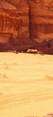 a train in the middle of a desert at Bedouin Horizons in Wadi Rum