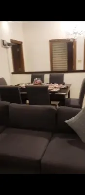 a living room with a couch and a table at عمان شارع مكه in Amman