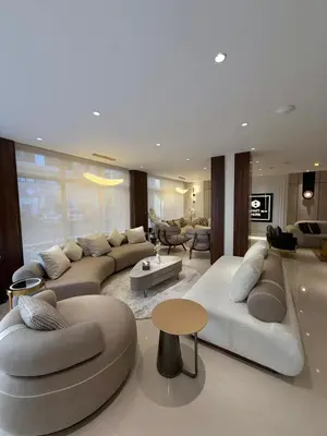 a large living room with couches and a table at AL Hyatt Relax Hotel in Aqaba