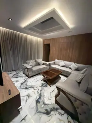 a living room with a large marble floor at Alma chalets in Aş Şarīḩ