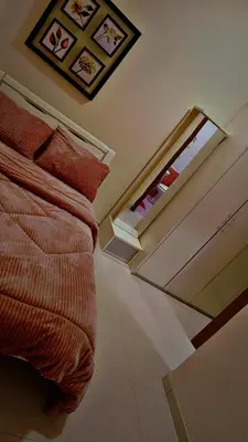 a bedroom with a bed with a window and a ceiling at شقه مفروشه للإيجار مكونه من 4 غرف في عمان in Amman