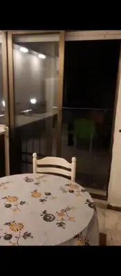 a dining room table with a flower patterned table cloth at شقه مفروشه بالكامل في عمان شارع مكه ضاحيه الأمير راشد in Amman