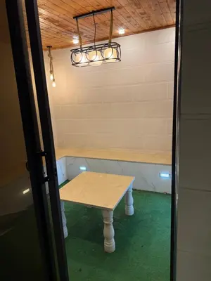 a small table in a room with a table in it at RoofTOP SPORTCITY in Amman