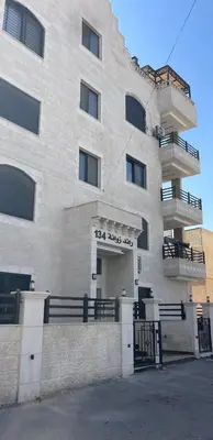 a building with a gate in front of it at RoofTOP SPORTCITY in Amman