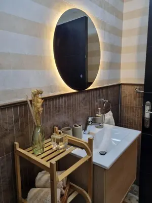 a bathroom with a sink and a mirror at Elegant 2 bedrooms in 4th circle-Diplomatic Area in Amman