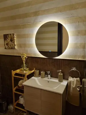 a bathroom with a sink and a mirror at Elegant 2 bedrooms in 4th circle-Diplomatic Area in Amman
