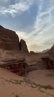 a view of the desert with rocks in the background at Stars light tent wadi rum in Wadi Rum