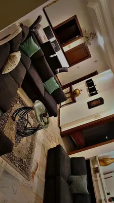 a living room with a bunch of pillows on the wall at ضاحيه الأمير راشد in Amman