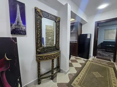 a mirror on a wall next to a room at Cozy Studio 2 Central Amman, Near Rainbow Street in Amman