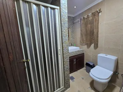 a bathroom with a toilet and a sink at Cozy Studio 2 Central Amman, Near Rainbow Street in Amman