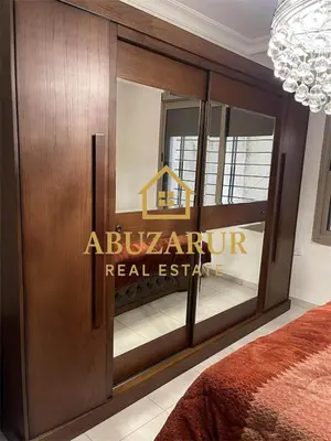a hotel room with a welcome sign on the door at Furnished apartment in Abdoun in Amman