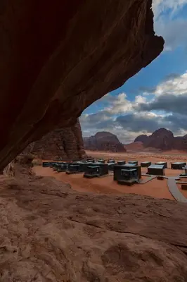 a group of picnic tables in the desert at Rum Reserve Resort-By Luxotel in Wadi Rum