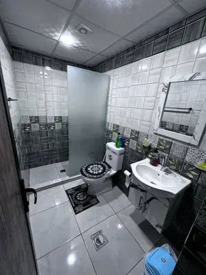 a bathroom with a toilet and a sink at Ahmad Wadi Rum Camp in Wadi Rum