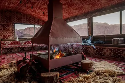 a fireplace in the middle of a room at Wadi Rum Bedouin in Wadi Rum