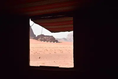 a window in a room with a view of the desert at Nature rum camp in Wadi Rum
