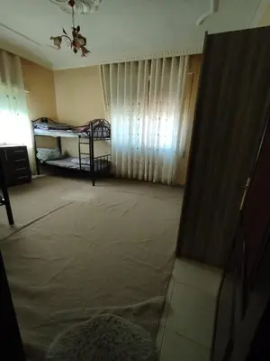 a room with two bunk beds and a window at طبربور in Amman