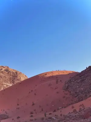 a sand dune in the middle of the desert at Wadi Rum Heritage Camp in Wadi Rum