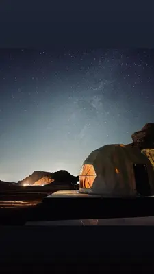 a tent in the desert under a starry sky at Tariq Camp Wadi Rum in Wadi Rum