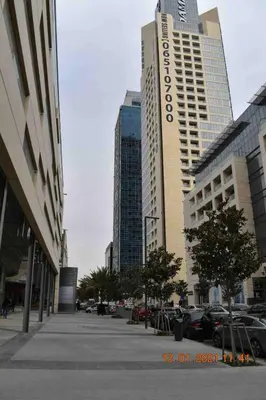 a group of tall buildings in a city at Luxury one bedroom apartment at Damac towers in Amman
