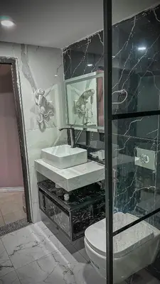 a bathroom with a sink and a toilet at BUBBLES CAMp in Wadi Rum