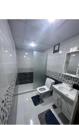 a bathroom with a toilet and a sink at Desert Stars Bubble Camp Wadi Rum in Wadi Rum