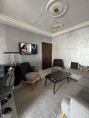 a living room with a couch and a table at 2bedroom-2bathroom-furniture in Amman
