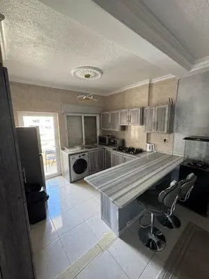 a kitchen with a large counter top in a room at 2bedroom-2bathroom-furniture in Amman