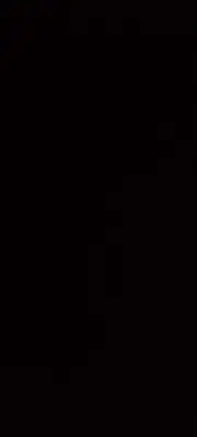 a dark room with a clock on the wall at Bright Stars Camp in Disah