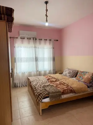 a bedroom with a bed and a window at panorama sea view apartment in Sowayma