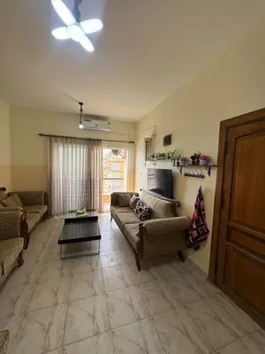 a living room with two couches and a table at panorama sea view apartment in Sowayma