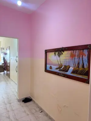 a large fish tank on a wall in a bathroom at panorama sea view apartment in Sowayma
