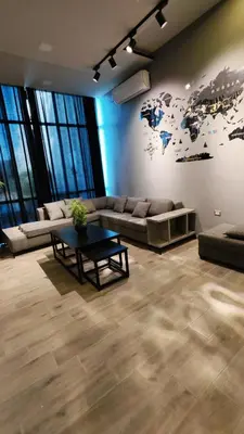 a living room with a couch and a table at LP chalet deadSea view in Sowayma