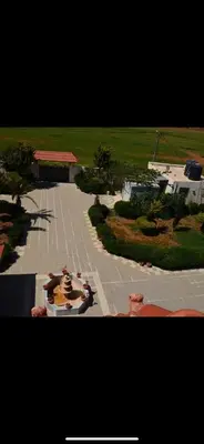 an aerial view of a parking lot with a building at Villa Qsai alnerat in Riḩāb