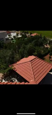 an overhead view of a red roof on a house at Villa Qsai alnerat in Riḩāb
