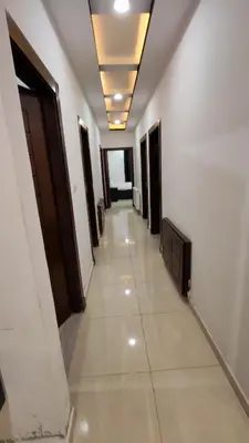 a long hallway with a corridorngthngthngthngthngthngthngthngthngthngth at La Perla Apertment Family in Amman